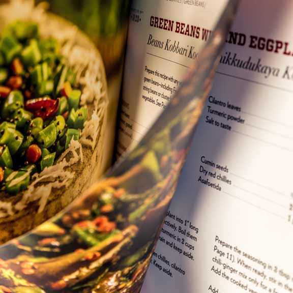 Closeup of the broad beans and eggplant recipe page spread.