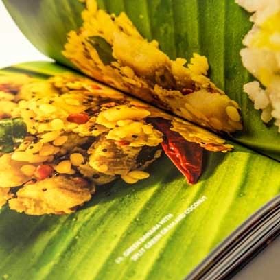 Closeup of the green banana with split green gram and coconut recipe page spread.