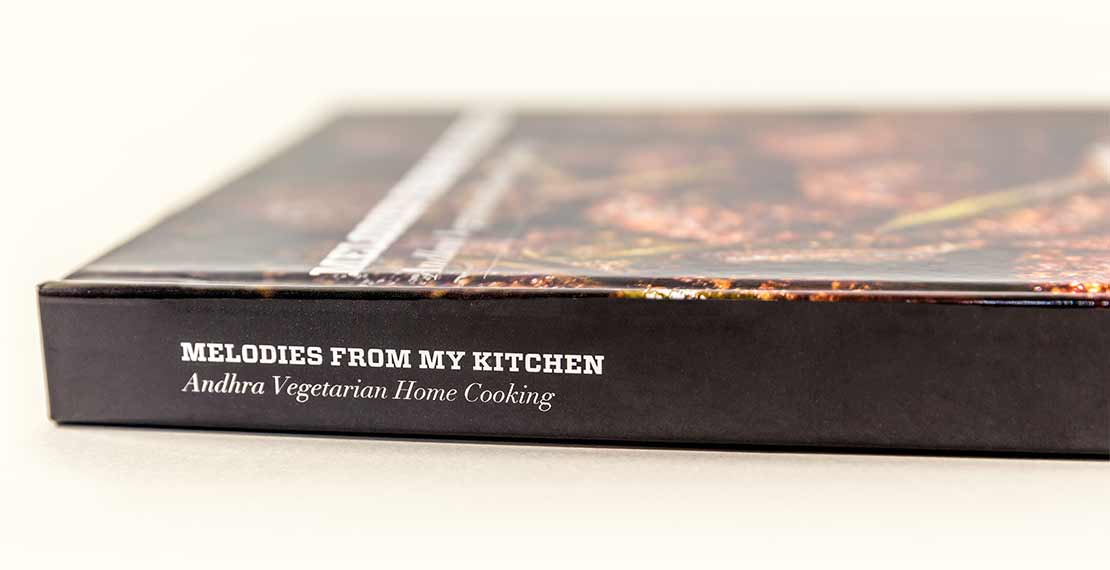 Spine of the book with the title text, Melodies from my kitchen, Andhra vegetarian home cooking.